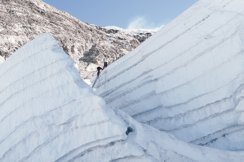 Climbers ascending through towering ice walls on the route to Island Peak in the Himalayas.